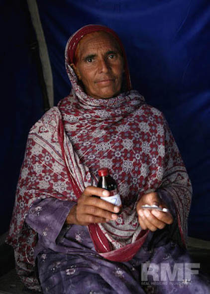 elderly woman receives medication