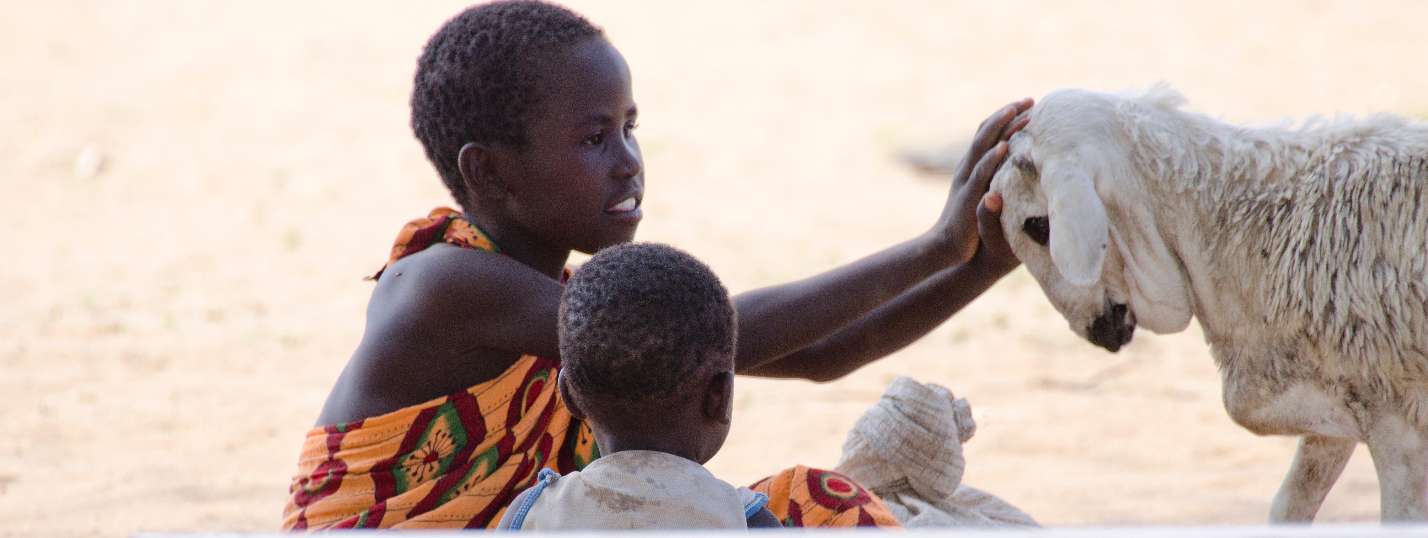 kenya turkana boy girl with goat